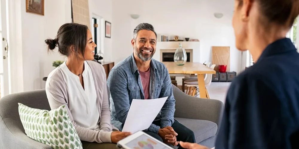 Couple Talking to Financial Advisor Couple Talking to Financial Advisor