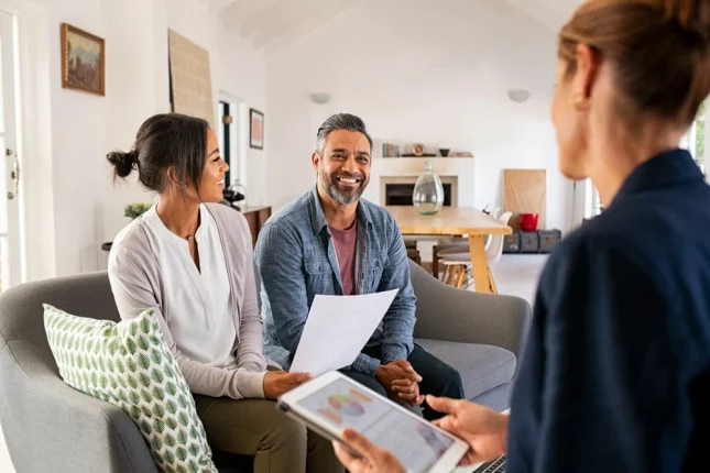 Couple Talking to Financial Advisor Couple Talking to Financial Advisor